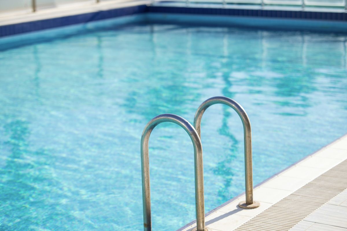 Ladder in a clear pool